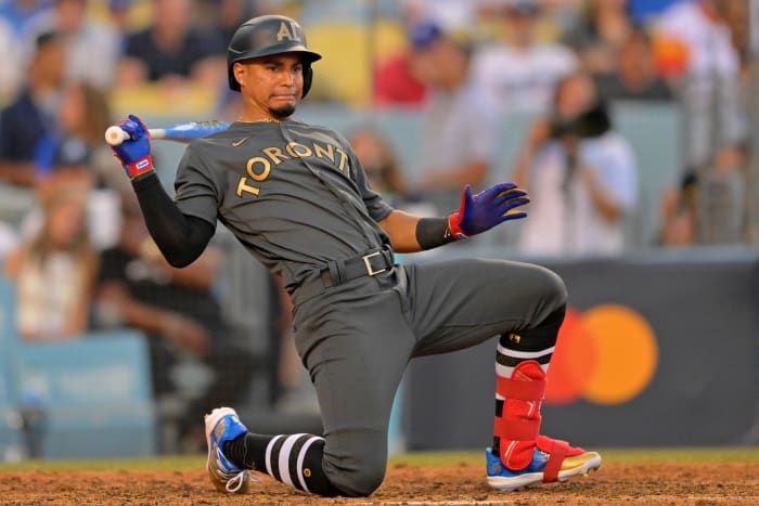 Santiago Espinal avoids a pitch.